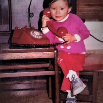 Photo of a young Amanda Chen talking on the phone
