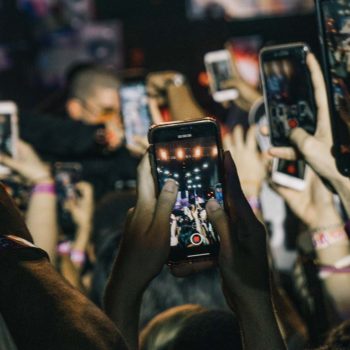 People recording concert with phones