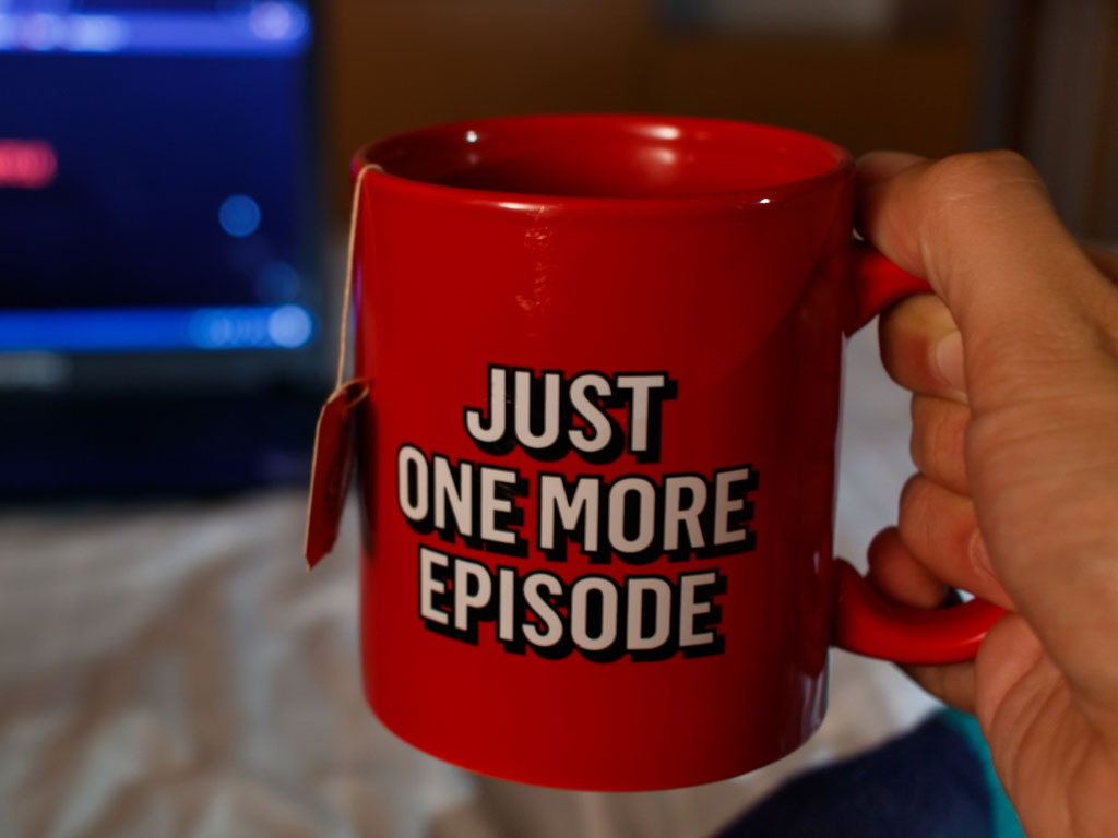 Coffee mug of someone binge watching streaming video.
